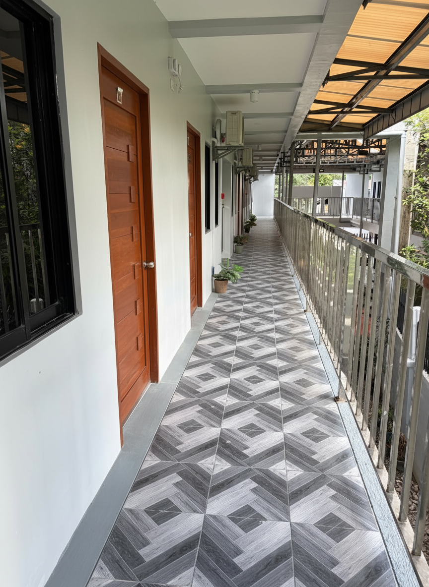 Hallway with patterned tile flooring and wooden unit doors