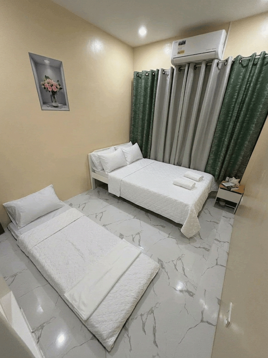 Bedroom with beds, air-conditioning, and marble floor
